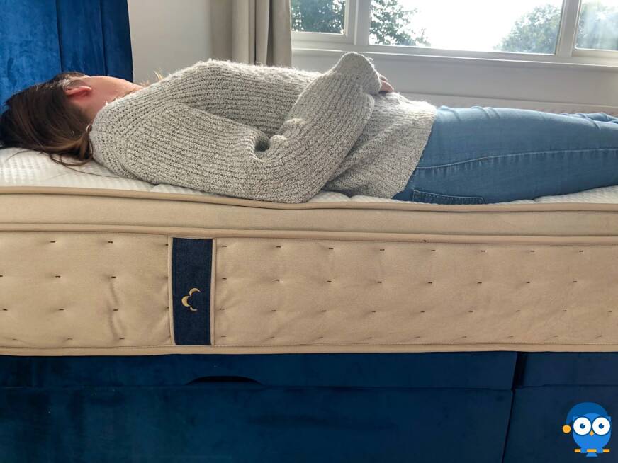 Person laying on back on DreamCloud mattress